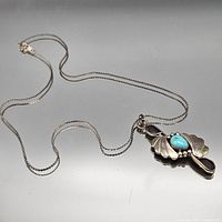 Full necklace laid flat showing chain and pendant