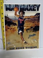 Full view of signed photo with ruler for scale