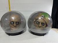 Front view of both Spirit Balls showing bald and turban heads