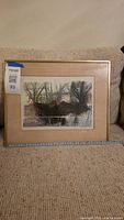 Front view of framed landscape print showing artwork, mat, and frame