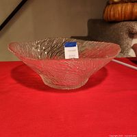 Side view of clear textured glass bowl on table