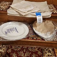 Platter and bowl stacked, wrapped for protection