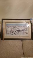 Full view of framed print on sofa