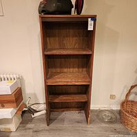 front view showing full height and three shelves