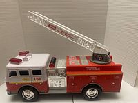 Right side view showing extendable ladder, decals, overall condition