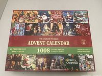Closed advent calendar box showing title, graphics, total pieces information