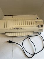 Top view of GBC DocuSeal 1200 laminator showing full unit and power cord