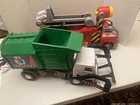 Fire truck and dump truck side by side