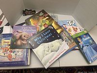 Group shot of all nine books spread on table