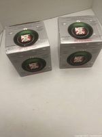 Two sealed retail boxes of Mr. Christmas digital photo ornaments.