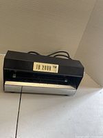 Front angled view of detector showing ID 2000 label, power cord, overall exterior