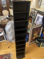 Front view showing eight shelves and adjustable pin holes