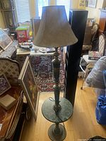 Full view of lamp with shade showing height and integrated marble shelf