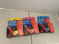 Front view of three Xerox cartridge boxes showing models Y101 cyan, Y102 magenta, Y103 yellow