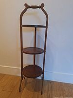 Full front view showing three tiers and overall structure