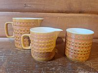 front view of three Hornsea Saffron pieces