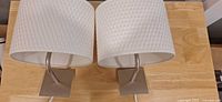 Both Ikea wall lamps on tabletop