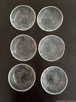 Six clear glass dessert bowls with leaf pattern displayed top view