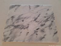 Full view of rectangular marble board showing veining pattern