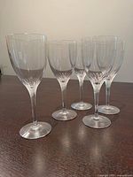 Five Orrefors Prelude white wine glasses standing to show shape and clarity