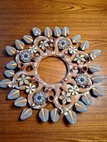 Full view of terracotta floral candle centrepiece