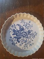 Top view showing blue floral Rhapsody motif and fluted edge