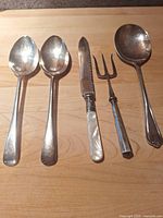 all five sterling pieces laid out