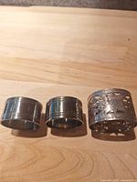 three napkin rings side by side on table