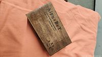 Closed wooden box labeled Alphabet