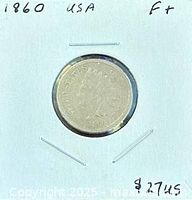 Obverse of 1860 Indian Head cent in 2x2 holder showing date and Liberty head