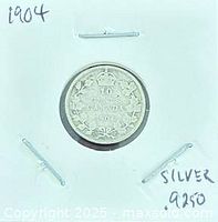 Reverse view showing 10 cents denomination, wreath and date