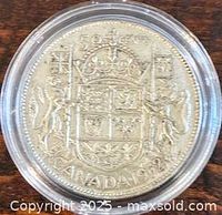 Reverse of 1952 Canadian 50-cent coin in holder