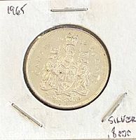 Reverse side of 1965 Canadian 50-cent coin in 2x2 holder