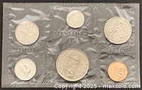 Front view of sealed 6-coin set showing reverse designs
