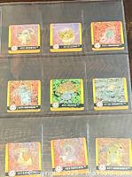 Nine lenticular cards in binder sleeve, fronts visible