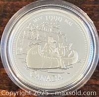Reverse of 1999 May Millennium silver 25-cent coin showing Voyageurs canoe design