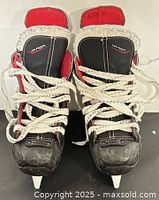 Front view of both Bauer Vapor X250 skates with laces and blades visible