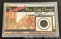 Front of Morgan Mint case showing illustrated card and coin