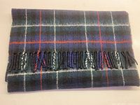 Folded tartan scarf showing pattern and fringe