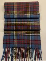 Full view of folded tartan scarf with fringe