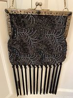 Front view of beaded handbag hanging