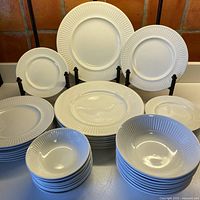 Full set of plates and bowls displayed