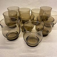 Front angled view showing all ten smoky brown tulip glasses