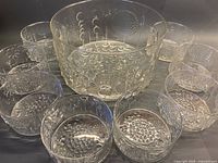 Entire set: large bowl centered, eight small bowls surrounding