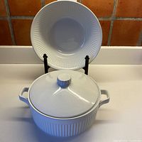 Both Johnson Bros Athena pieces, bowl displayed upright and covered dish in front