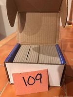 Open box showing neatly stacked hockey cards