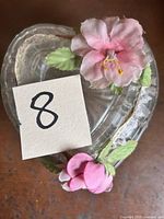 Top view of glass heart dish lid with pink fabric flowers