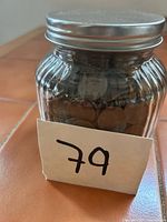 Jar front view showing wheat pennies inside