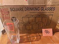 Box front showing Le'RAze square drinking glasses graphic and one glass removed