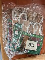 Bundle of assorted paper gift bags sealed in plastic